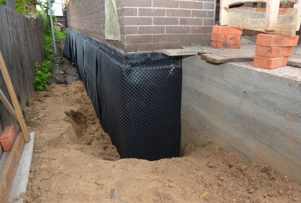 Happy homeowners after waterproofing job in Equality